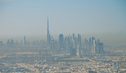 Wall Mural - Aerial view of Downtown Dubai from the airplane at sunrise