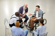 High angle  portrait of handicapped man sharing troubles with support group during therapy session, copy space