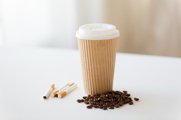 Poster - bad habits, addiction and unhealthy lifestyle concept - close up of cigarettes, takeaway coffee cup and roasted beans on white table