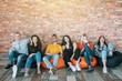 canvas print picture - Millennials hanging out in lounge zone. Young people resting in bean bags, having fun together, enjoying break at work.