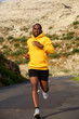 © mimagephotos - healthy african american man running on street