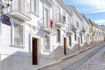 Typical Street in Estepa, province of Seville. Charming white village in Andalusia. Southern Spain. Picturesque travel destination on Spain.