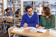 © JackF - Couple of students studying in library