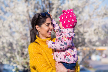 Happy Woman and  Kid in the Spring Park  .Happy Family Portrait