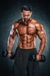 © mrbigphoto - Bodybuilder exercise With Dumbbells