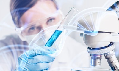 Wall Mural - Young female scientist standing in her lab.