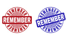 Grunge REMEMBER Round Stamp Seals Isolated On A White Background. Round Seals With Grunge Texture In Red And Blue Colors. Vector Rubber Watermark Of REMEMBER Text Inside Circle Form With Stripes.