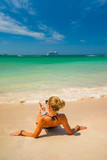 Fototapeta Łazienka - Woman enjoying her holidays on the tropical beach i