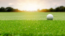 White Golf Ball On Green Course To Be Shot On Blurred Beautiful Landscape Of Golf Course In Bright Day Time With Copy Space. Sport, Recreation, Relax In Holiday Concept	