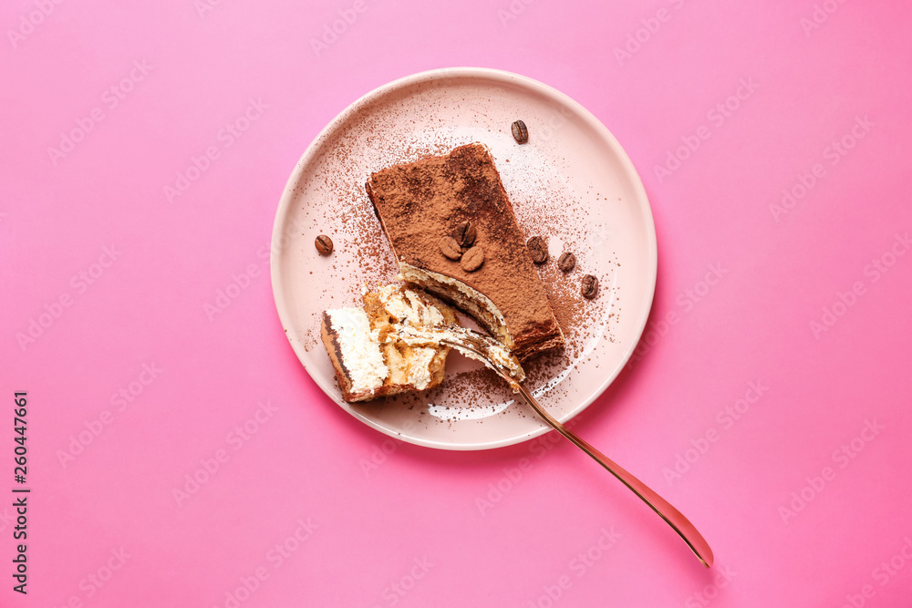 Plate with tasty tiramisu on color background