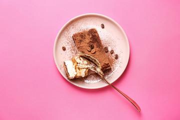 Plate with tasty tiramisu on color background