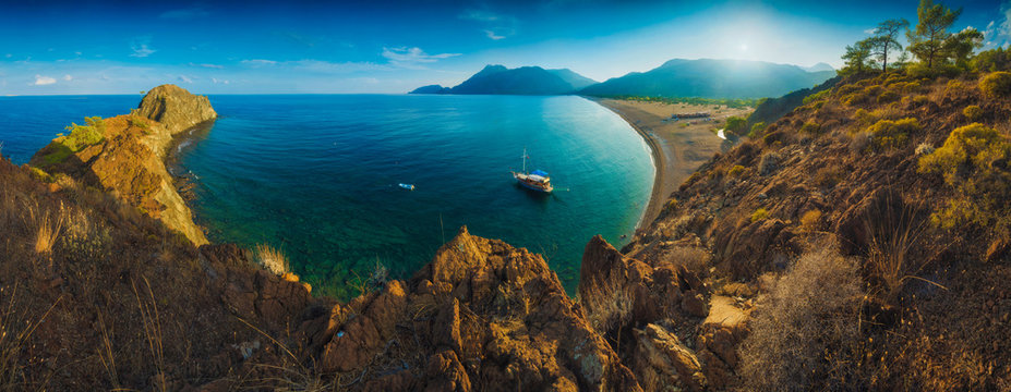 Panorama of Cirali beach and Olimpos mountain in a sunset
