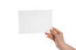 © Pixel-Shot - Female hand with blank invitation card on white background