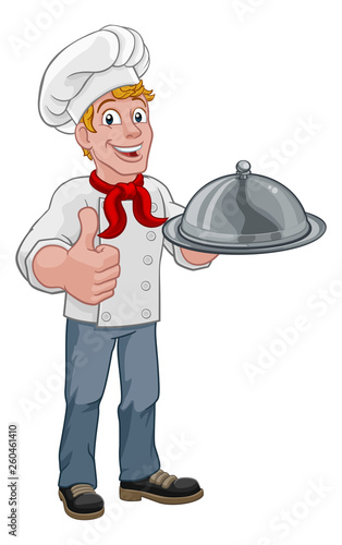 A chef holding a silver pla...