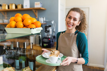 Wall Mural - waitress ready to serve food in cafe