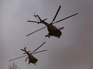 Wall Mural - Mi-8 helicopters in the cloudy sky