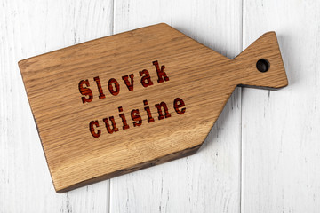 Wall Mural - Wooden cutting board with inscription. Concept of slovak cuisine