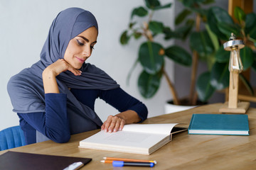 Sticker - Arabian woman reading a book