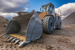 © Enrique del Barrio - Bulldozer type excavator working in a rock and stone processing plant for gravel processing