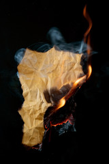 Wall Mural - .burning piece of crumpled paper