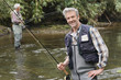 © goodluz - Two fly fishermen in river
