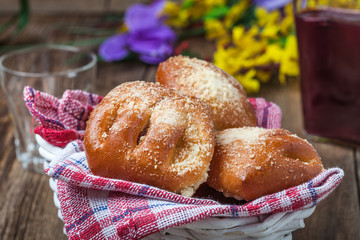 Buns with berries on a wooden table.