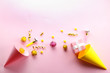 © Evrymmnt - Birthday party traditional accessories and celebration attributes on bright paper textured background. Close up, top view, copy space, flat lay.