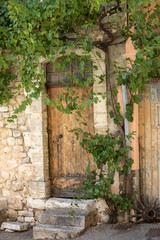 old tenement house overgrown with ivy in Sault, Vaucluse department in Provence region, France