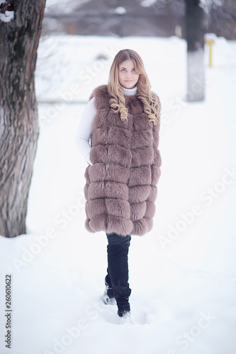 Girl In A Fur Vest Walks In The Winter Outside Adult Young Model