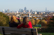 Women Overlook London Skyline in Autumn
