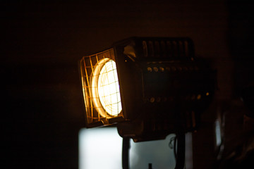 Huge stage projector lamp from a theatre with a warm yellow color