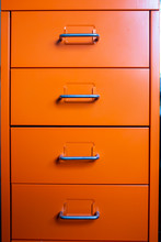 Filing Cabinet With Closed Drawer, Orange Metal Colour, Administration And Storage Concept