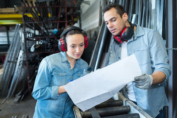 two worker in factory on the machine