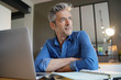 © goodluz - Mature man working from home at the weekend