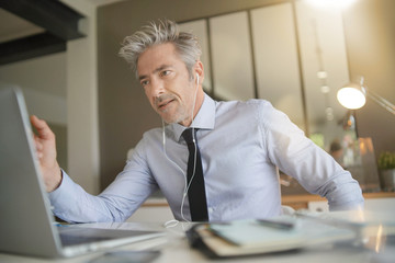 Businessman on video call in contemporary office