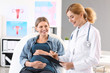 © Pixel-Shot - Young pregnant woman visiting her gynecologist in clinic