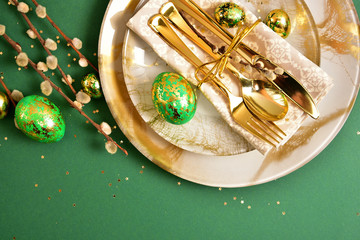 Wall Mural - Table setting in easter style. Mimosa, painted green eggs, golden cutlery.