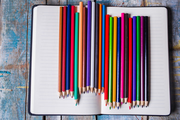 Blank notepad and  pencils