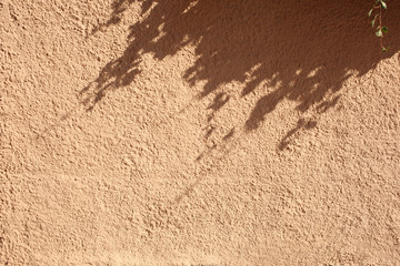 light and shadow on plaster wall with copy space for your text