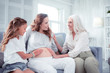 © Viacheslav Yakobchuk - Women of three generations feeling excited expecting new baby