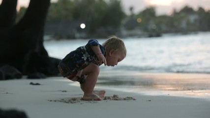 Sticker - Happy beautiful fashion family, children, dressed in hawaiian shirts, playing together on the beach on sunset, famiy joyful vacation