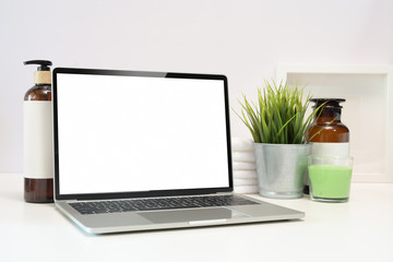 blank screen laptop on spa table
