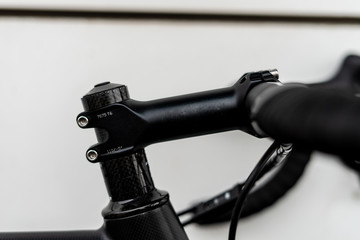 Shiny black handlebar stem - racing road  bike part