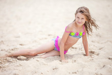 Beautiful Young Girl Relaxing On The Beach. Portrait Of Teen Girl On Sea Sand