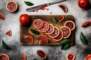 Wall Mural - Fresh ripe red oranges on dark background. Healthy orange fruits background many orange fruits. 