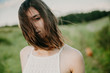© matilda553 - Happy woman with windy messy hair backlit by sun selective focus colorized image