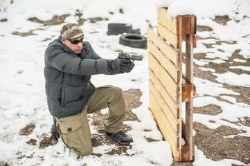 Combat gun shooting training behind and around cover or barricade