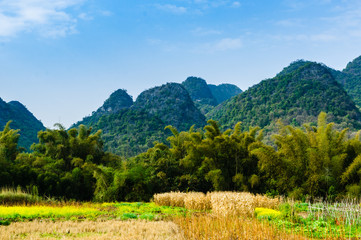 Countryside and mountain scenery with blue sky background 