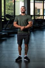 Wall Mural - Handsome Man Posing In Green T-shirt