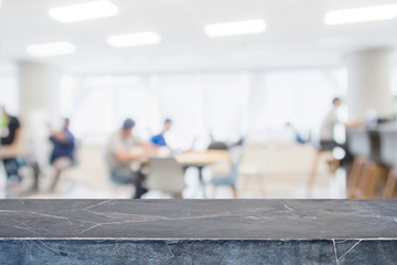 Empty black marble stone tabletop and blurred bokeh office interior space banner background - can used for display or montage your products.